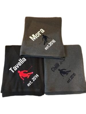 Three personalized ski-themed fleece blankets