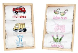 Embroidered baby onesies in wooden gift boxes