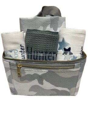 Camouflage travel pouch filled with towels
