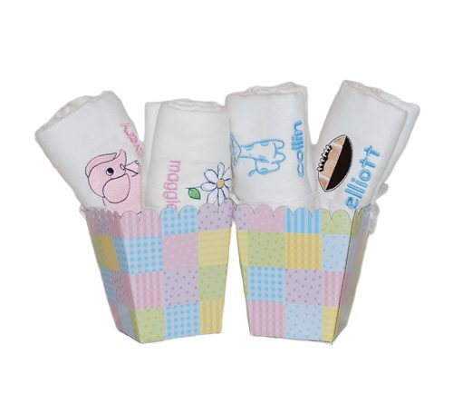 Rolled baby burp cloths in pastel holders