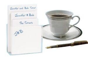 Handwritten index cards, teacup, fountain pen