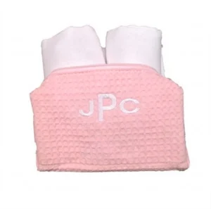 Pink waffle pouch with two white towels
