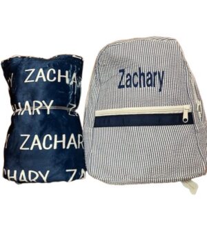 Striped backpack and navy pillow named Zachary
