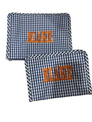 Two blue gingham pouches embroidered "BLAKE