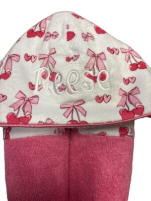 White hooded towel with pink bows