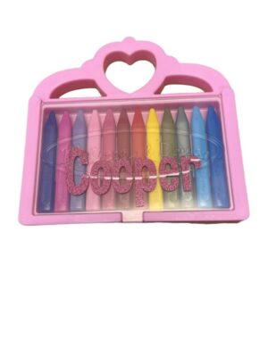 Colorful crayons in pink heart carrying case