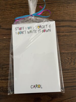 Wrapped notepad with colorful ribbon and reminder