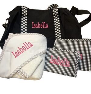 Black bag with personalized embroidered baby items