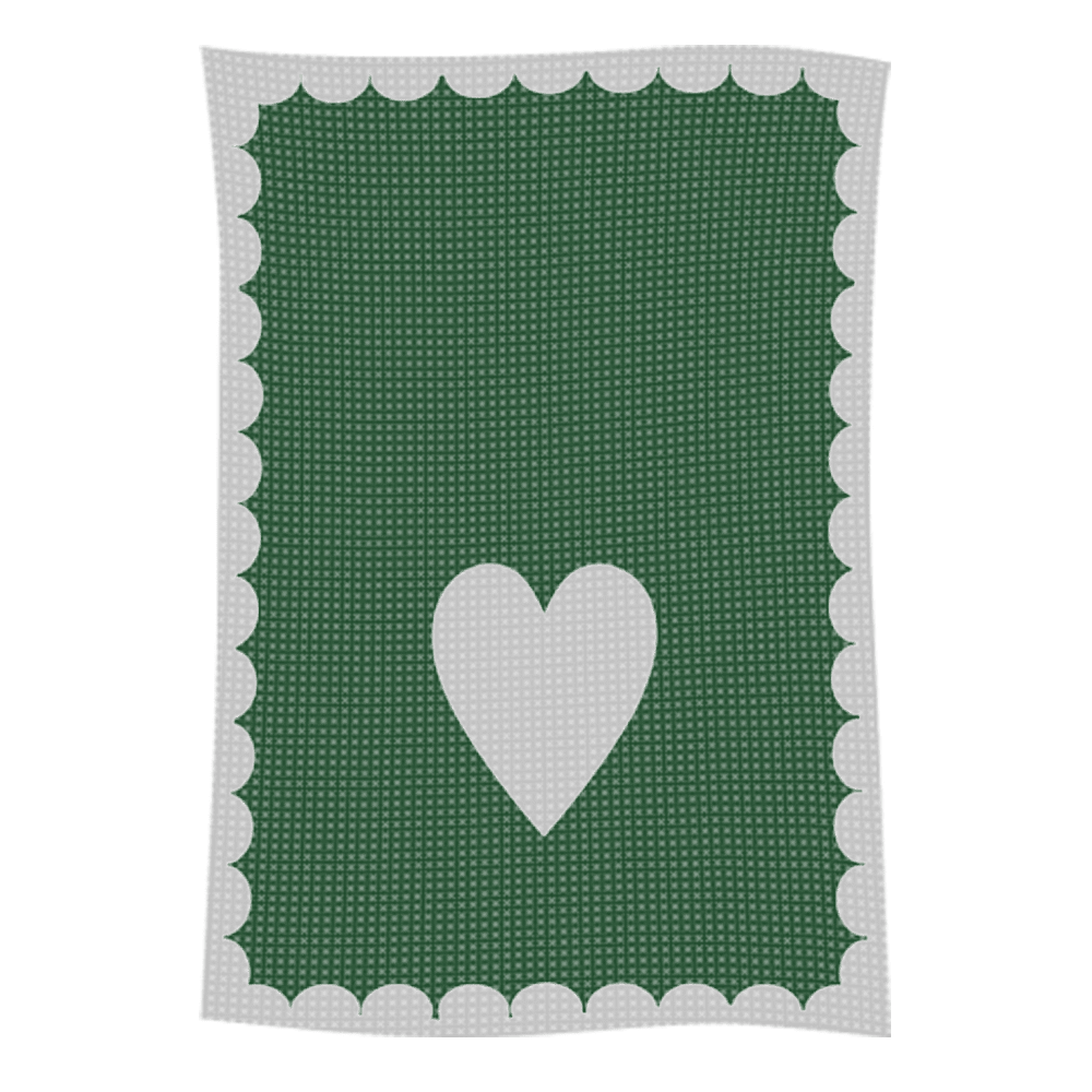 Green crocheted blanket with white heart
