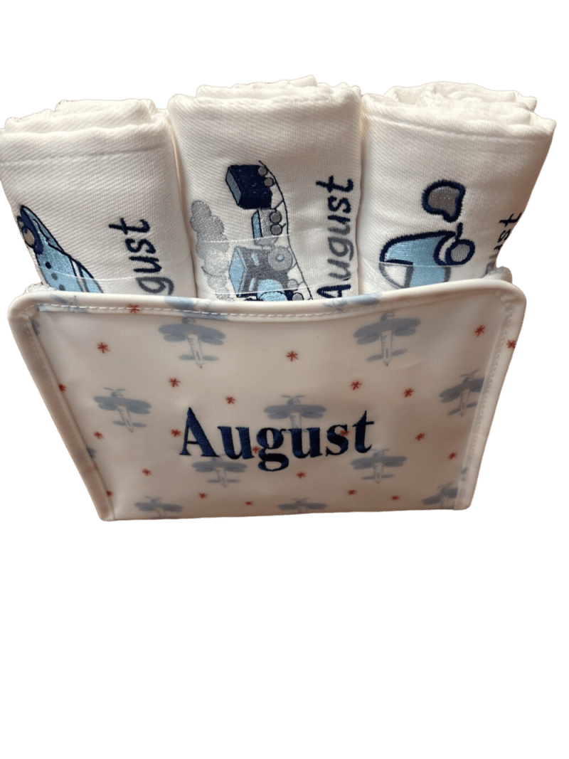 Ceramic holder labeled "August" with rolled cloths
