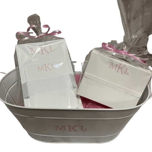 White metal tub holding MKL wrapped gift boxes