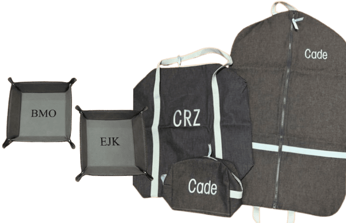 Gray monogrammed travel bags and valet trays